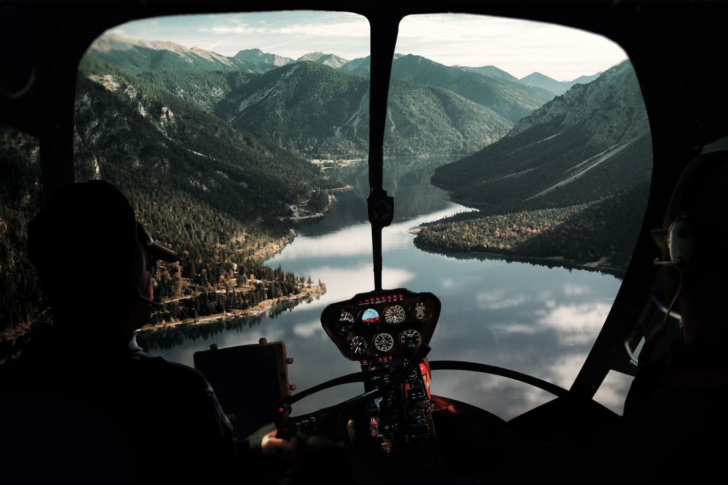 Breathtaking View from Helicopter Cockpit Over Mountain Lake